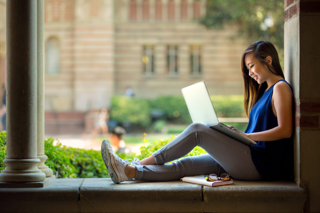 Student using a laptop outdoors