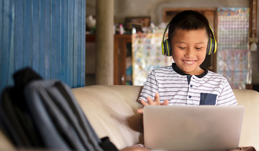 Young boy using a laptop