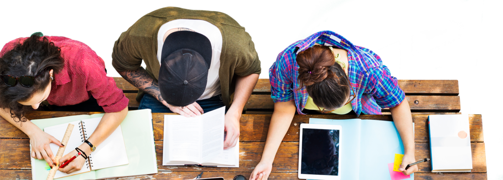 Three students working at a table