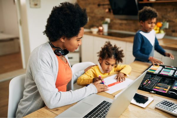 A mother and child using a laptop