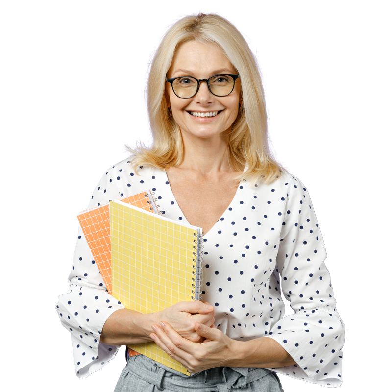 A teacher holding notebooks